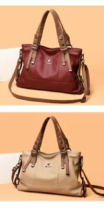 Close-up of litchi grain texture and metallic logo on burgundy and beige handbags