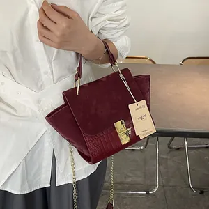Chic burgundy frosted vintage wing tote bag with gold metal hardware for women