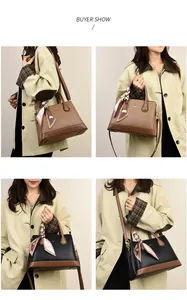 Detailed views of the litchi pattern leather handbag with silk scarf and logo