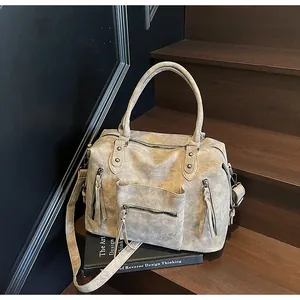 Detailed view of vintage frosted tote with dual zipper pockets and rivet accents