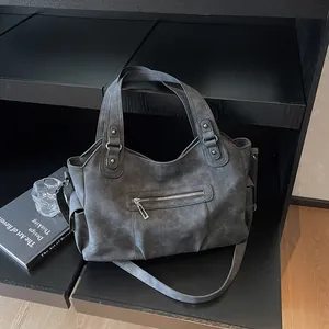 Matte dark grey retro tote bag with multiple pockets and adjustable shoulder strap
