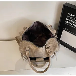 Overhead shot of vintage tote bag interior featuring dark lining and large capacity