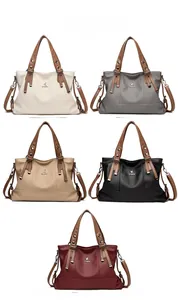 Multiple color display of minimalist crossbody tote bags in five different elegant shades
