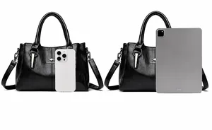 Detaillierter Größenvergleich der schwarzen Lederhandtasche mit iPhone und iPad