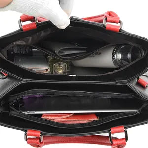 Large black pebbled leather tote bag for women with red handles and multi-layer interior