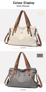 Detailed view of large leather tote bags in off-white and grey with brown straps
