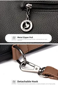 Close-up of pebble leather texture with luxury silver-tone zipper and metal hardware hooks