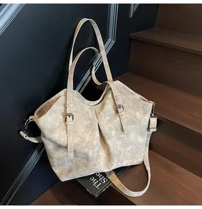 Detailed view of vintage matte tote bag showing high-quality texture on wooden stairs
