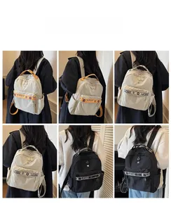 On-body view of cream and black backpacks showing shoulder straps and multi-pocket layout