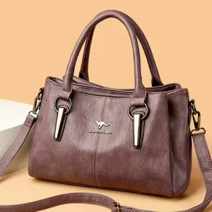 Sac à main violet foncé en cuir grainé avec bandoulière réglable et doubles poignées