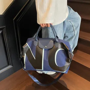 Large capacity navy travel bag with leather handles and letter design for fitness