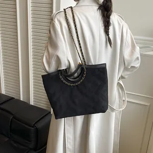 Large black quilted tote bag with chain strap, stylish matte shoulder bag for women