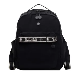 Minimalist black nylon casual backpack with logo strap and front zipper pocket