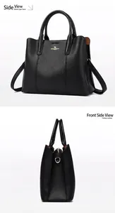 Gros plan sur le sac cabas en cuir grainé noir avec logo doré et texture détaillée