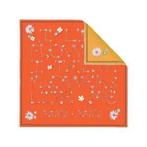 Vibrant orange square silk scarf with floral lettering and a golden yellow reverse side