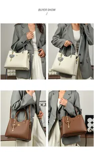 Detail showing faux leather handbags in beige and brown with adjustable straps and charms