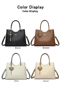 Detail view of four large leather tote bags in black, brown, white, and apricot colors