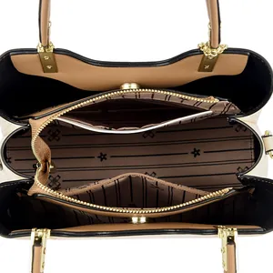 Large beige and tan crossbody bag interior with multiple compartments and striped lining