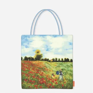 Detail of canvas tote bag featuring Monet Poppy Field art print and blue rope handles