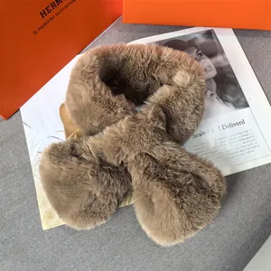 Thick plush faux fur scarf in camel brown with a crossed design for winter warmth