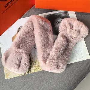 Detail of soft plush faux fur scarf in dusty pink with thick fluffy texture and sheen