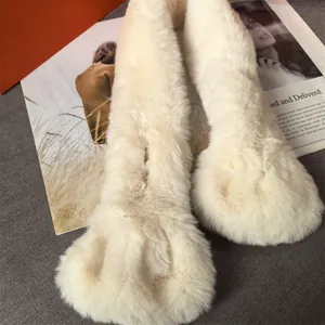 Detailed view of plush faux fur scarf in cream white showing soft fluffy texture