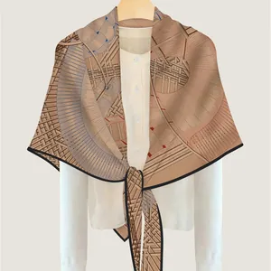 Elegant khaki geometric architectural print silk shawl draped over a white shirt