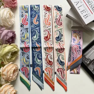 Collection of paisley print skinny silk scarves for handbag handles in various colors