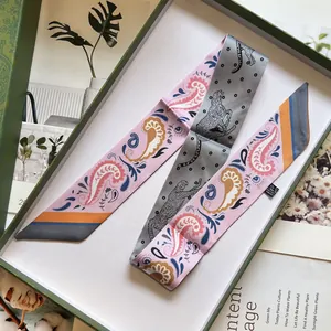 Polyester twilly scarf featuring pink paisley and leopard print patterns in a gift box