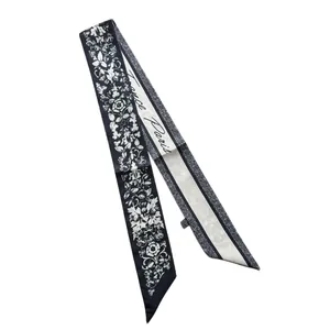 Elegant black and white long silk scarf with floral patterns and Paris typography