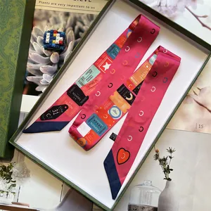 Pink patchwork long silk twilly scarf with vintage ticket print in a green gift box