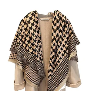 Classic houndstooth thick cashmere-feel shawl with fringe details on a white background