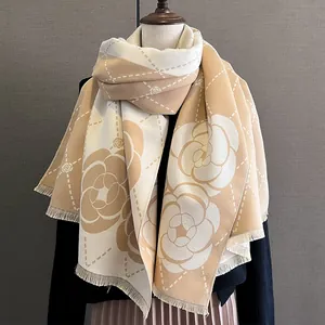 Milk tea camellia pattern faux cashmere shawl scarf draped over a model