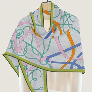 Colorful printed velvet triangle shawl with abstract patterns and hand-rolled edges
