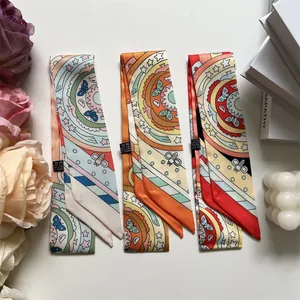 Detailed view of three bohemian twill scarves with mandala prints and 100% polyester labels