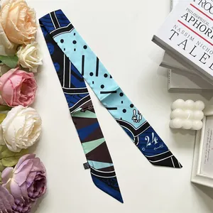 Macro view of blue geometric silk scarf handle strap for DIY bag decoration and extension