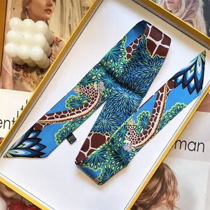 Macro detail of high-quality silk twilly scarf with giraffe and floral patterns