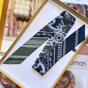 Vintage paisley silk skinny scarf in gift box with candle and magazine decoration