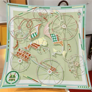 Detail of classic silk square scarf featuring vintage carriage motifs and green border