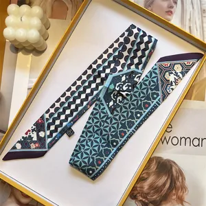 Elegant long skinny silk scarf with blue geometric floral prints in a luxury gift box