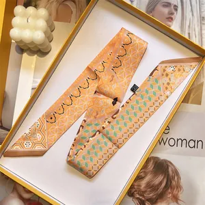 Long silk-feel neck scarf with orange geometric floral print in a premium gift box