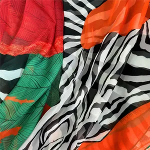 Macro detail of tropical leaf and zebra print on lightweight chiffon sunshade scarf