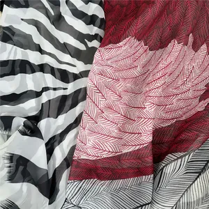 Detail of georgette shawl fabric showing zebra print and feather patterns with soft drape