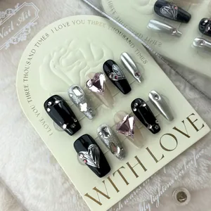 Handmade black and pink Y2K press-on nails with silver glitter and heart rhinestones
