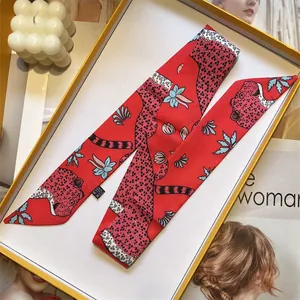 Red silk scarf with leopard print and floral design in an elegant gift box set