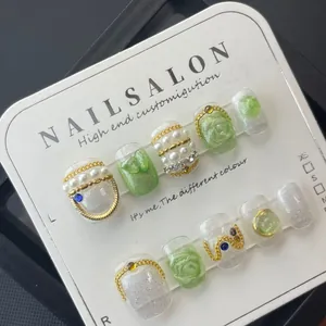 Handmade bohemian short press-on nails with pearl accents and 3D floral designs