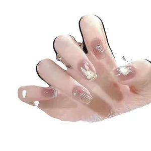 Handmade 3D rabbit press-on nails with pink cat eye base and pearl rhinestone accents