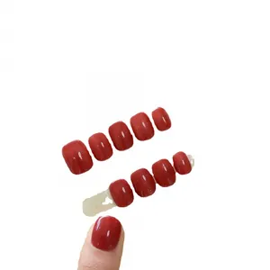 Handmade glossy deep maple red press-on nails set in classic squoval shape for women