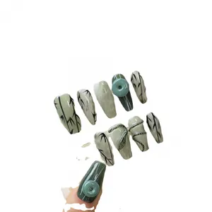 Handmade press-on nails with dark green jade marble pattern and 3D bamboo relief motifs