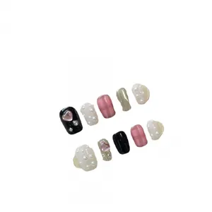 Pink and black plaid press-on nails set with 3D hearts and pearl accents